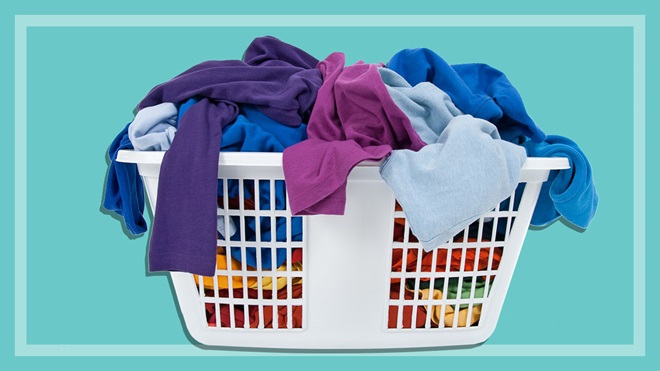 large pile of clothes in washing basket